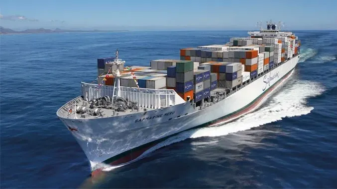 A Maersk Safmarine container ship moves swiftly across a blue ocean with a prominent white hull and red waterline markings