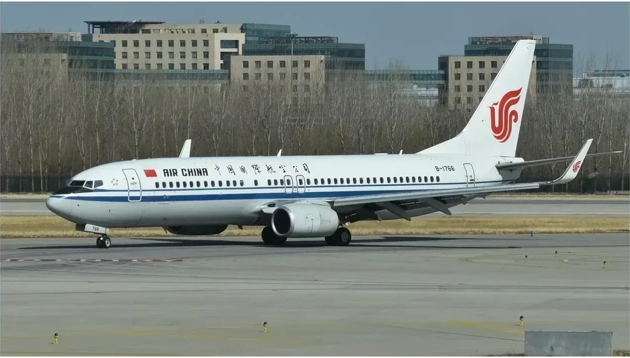 A China Airlines Boeing 767 aircraft is pictured on a runway with the tail fin prominently displayed in blue and white