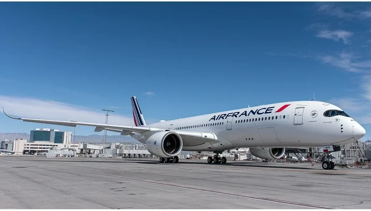 An Air France aircraft sits on the tarmac at an airport terminal its distinctive livery clearly visible ready for flight