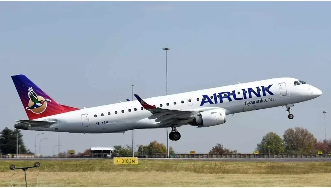 An Airlink aircraft with a vibrant South Africa hero livery is captured in flight against a cloudy sky The jet appears to be