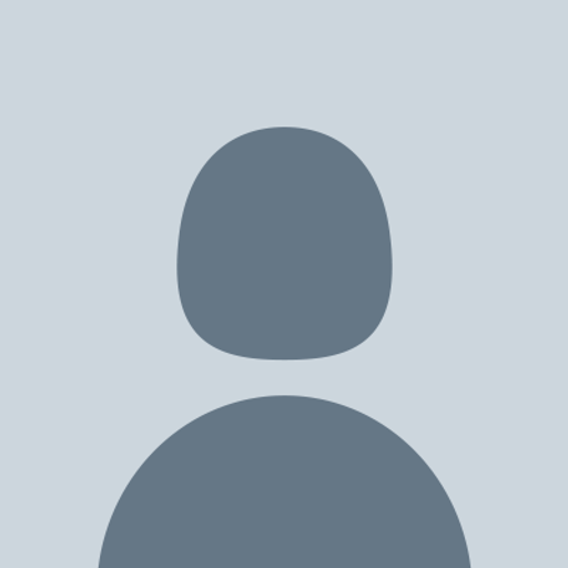 A solid dark grey circle is depicted against a light grey background The circle represents a logo icon