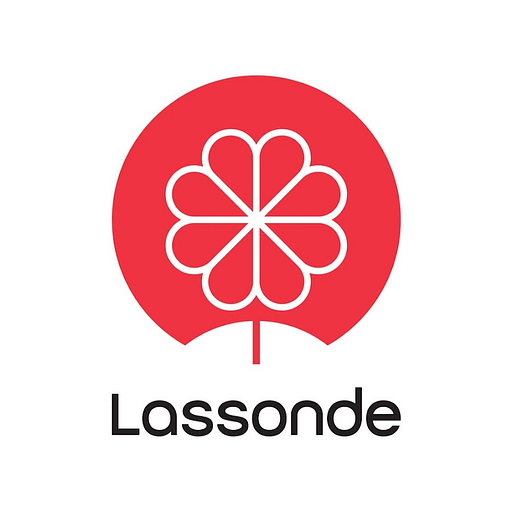 A stylized logo featuring the Lassonde Inc name and a single stylized leaf symbol represents the companys brand