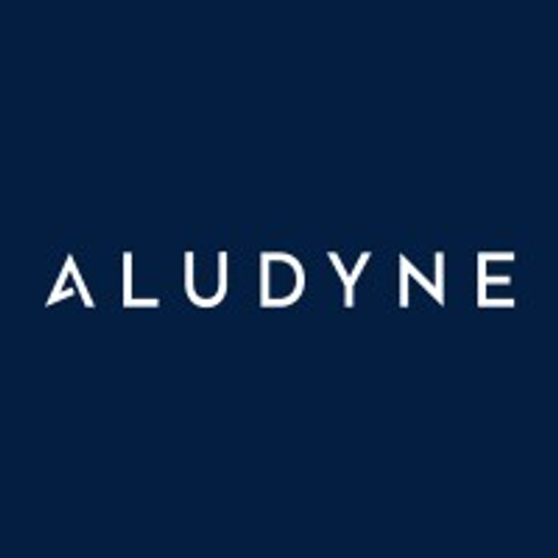 The Aludyne North America Inc logo displays the companys name in a bold typeface against a dark blue background