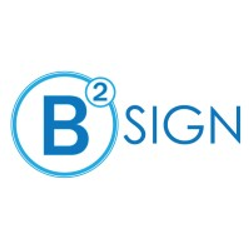 A white sign with the text B2 Sign Inc in a blue font represents the companys brand identity