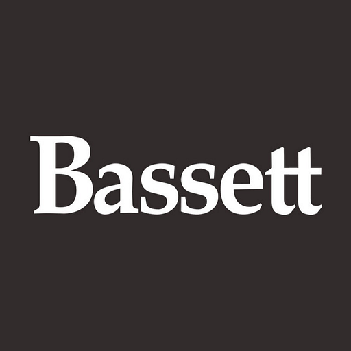 The Bassett Mirror Co Inc logo featuring a stylized mirror design with the company name prominently displayed
