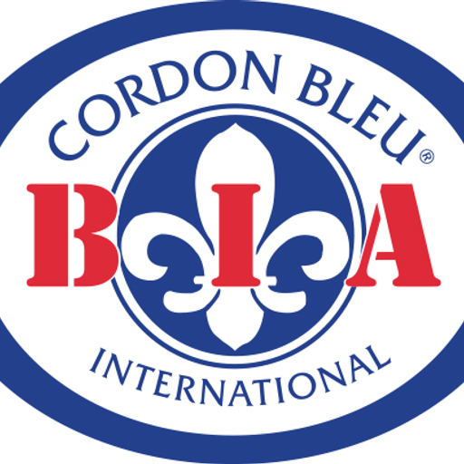 A white fleurdelis emblem dominates the image representing the BiaCordonBleu Inc logo with blue accents