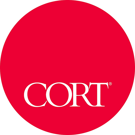 The Cort business service Corp logo features a stylized shield design with the company name prominently displayed in bold