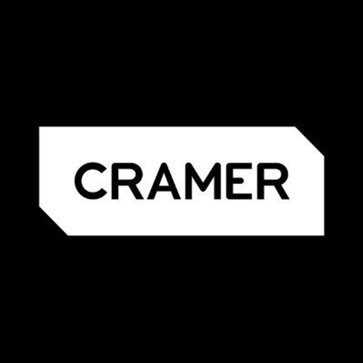 Cramer Decker Industries logo featuring a stylized airplane design with a red and white color scheme