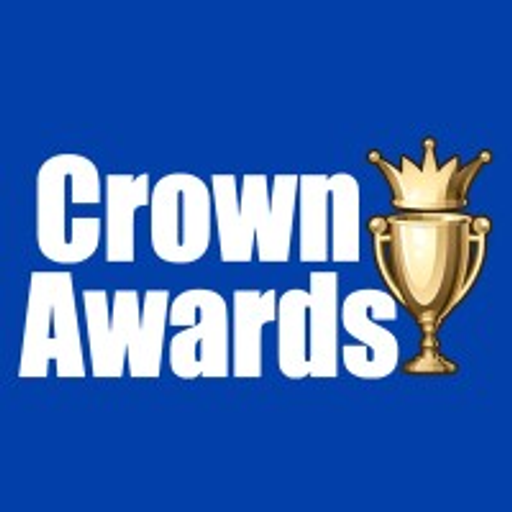 A golden trophy shaped like a crown stands prominently representing an awards ceremony or recognition