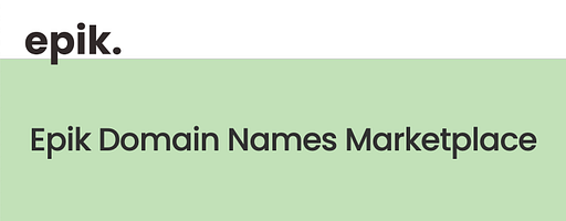 A man stands in a bathroom with a logo visible on the wall His attire suggests a corporate setting and the bathroom appears