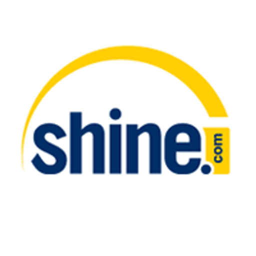 Shine Corp logo featuring a stylized yellow sunburst design representing energy and innovation in a corporate setting